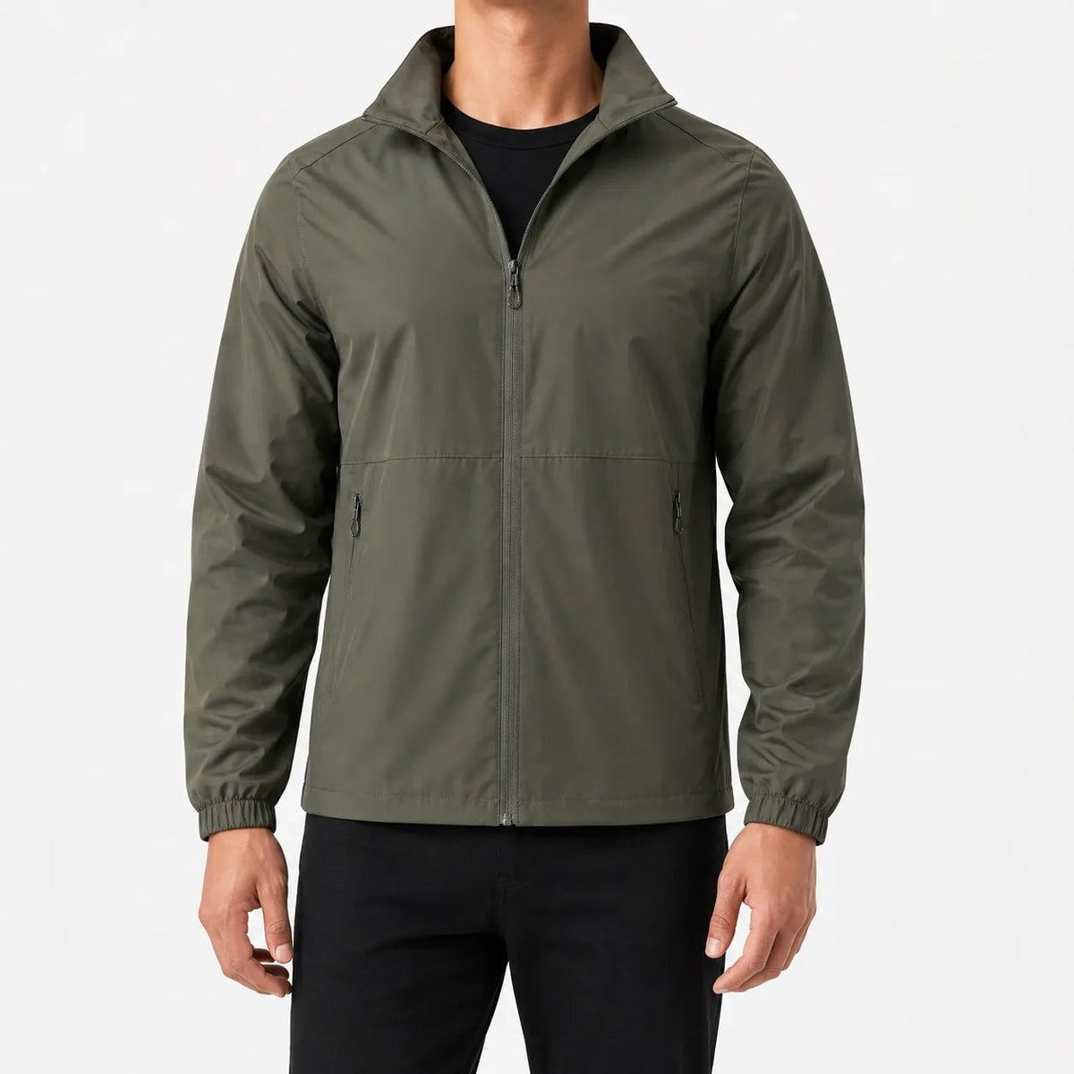 Man wearing olive green zip-up jacket with black pants, front view | Chaps London