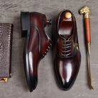 Burgundy lace-up oxford dress shoes, glossy finish, flat lay with accessories | Chaps London