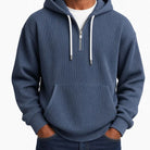 Man wearing slate blue ribbed half-zip hoodie with white drawcords | Chaps London