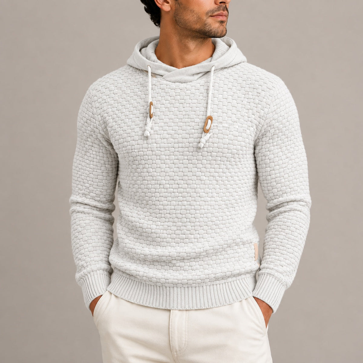 Man wearing light grey basket weave knit hoodie with wooden toggles | Chaps London