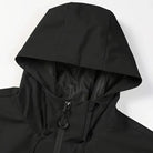 Black hooded rain jacket close-up showing zipper and drawstring details, worn by person | Chaps London