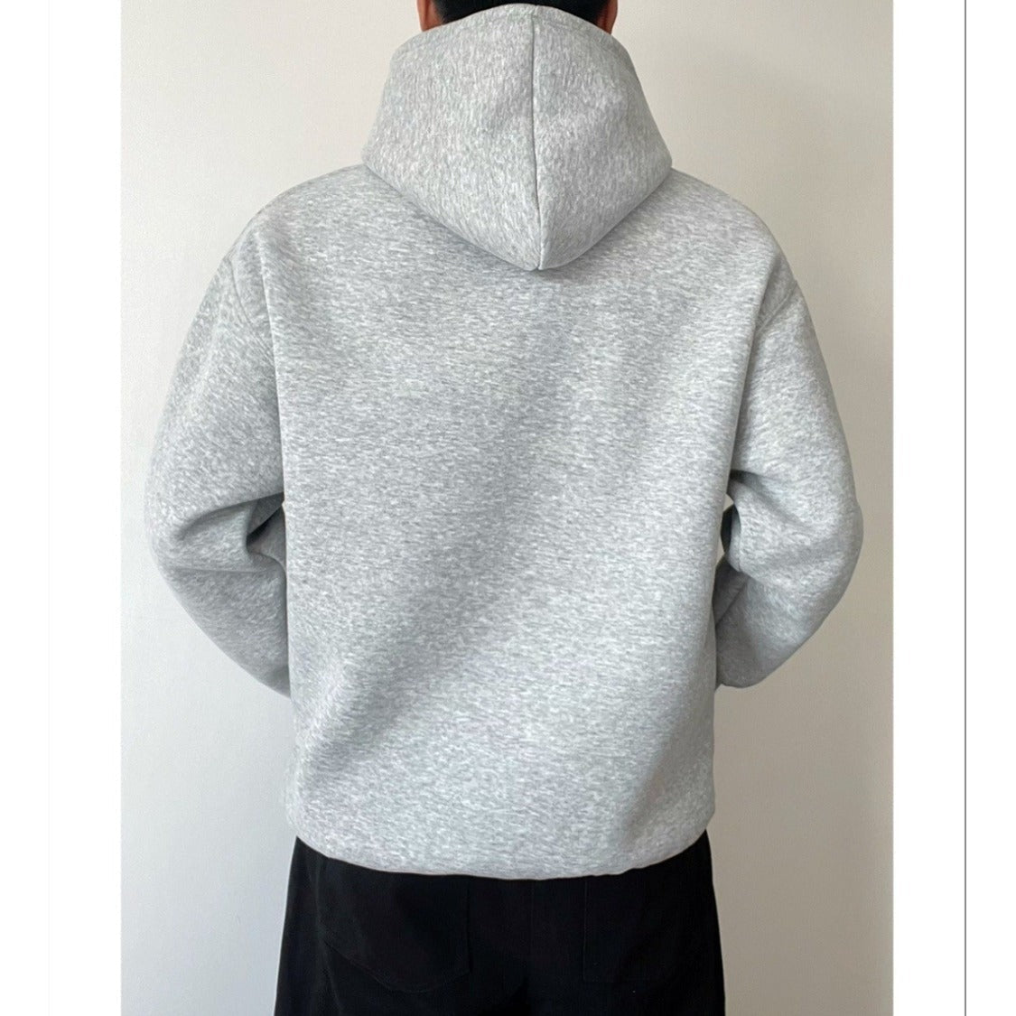 Gray oversized hoodie worn by person, back view, showing hood | Chaps London