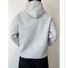 Gray oversized hoodie worn by person, back view, showing hood | Chaps London