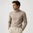 Man wearing beige ribbed turtleneck sweater with cream trousers, fine knit fabric | Chaps London