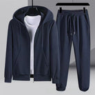 Navy blue waffle-textured zip hoodie and jogger pants on hangers | Chaps London
