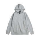 Grey oversized hoodie with snap neck button detail, flat lay view | Chaps London