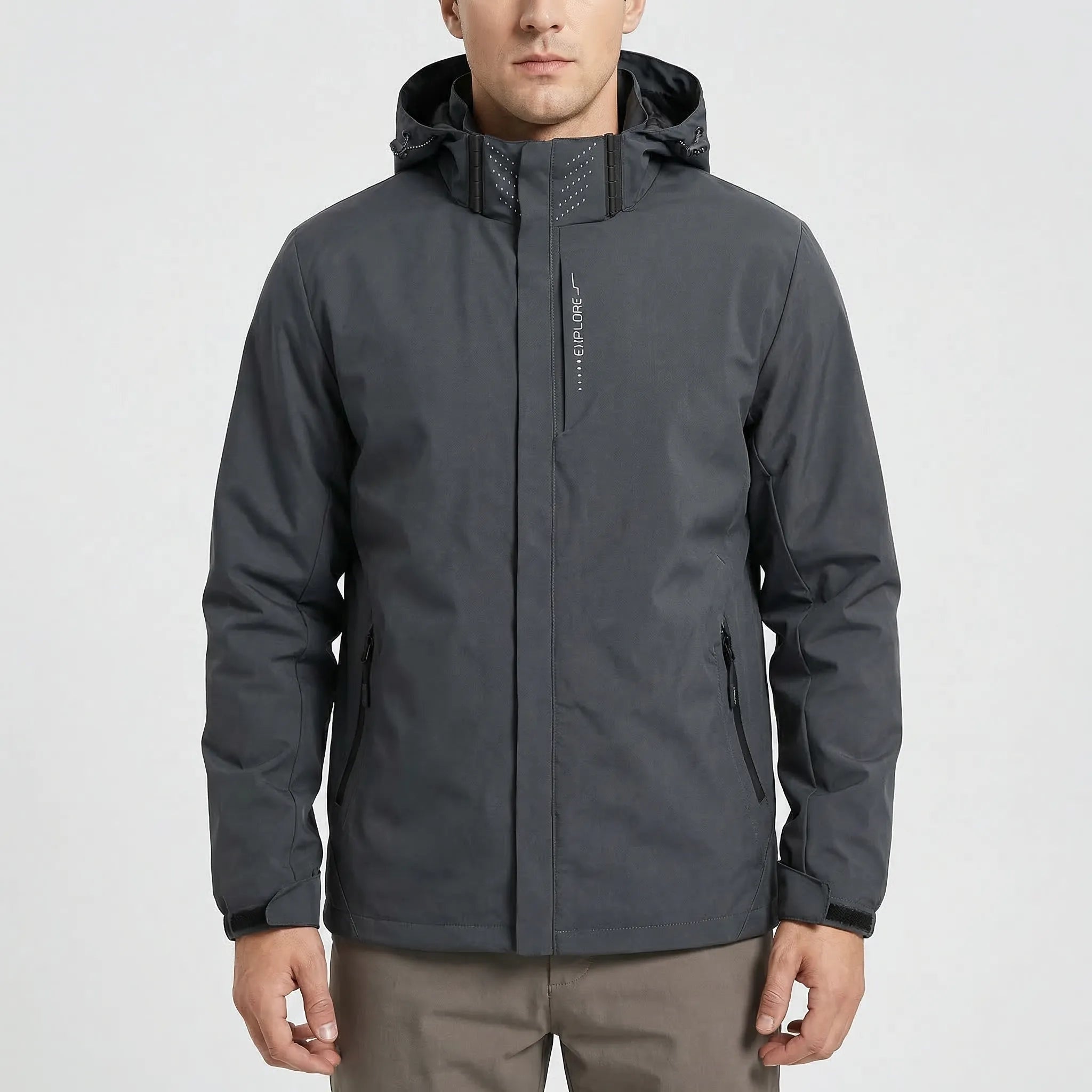 Man wearing dark grey hooded rain jacket with front zipper, worn outdoors | Chaps London