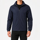 Man wearing navy zip-up rain jacket with black pants, front view | Chaps London