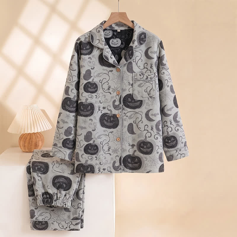 Grey pyjama set with pumpkin and moon print, hanging on hanger | Chaps London