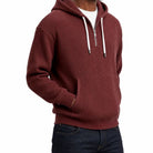 Man wearing burgundy ribbed half-zip hoodie with white drawcords, front pocket | Chaps London