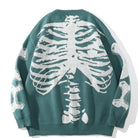Green knit sweater worn by person, white ribcage and bone skeleton print | Chaps London