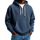 Man wearing navy blue ribbed half-zip hoodie with drawstrings, worn casually | Chaps London