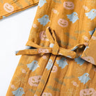 Mustard kimono robe with pumpkin and ghost print, tied belt detail shown flat | Chaps London