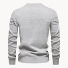 Gray knitted sweater back view with ribbed sleeve detailing, worn by person | Chaps London