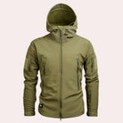 Olive green hooded softshell jacket with zip pockets, worn by a person | Chaps London