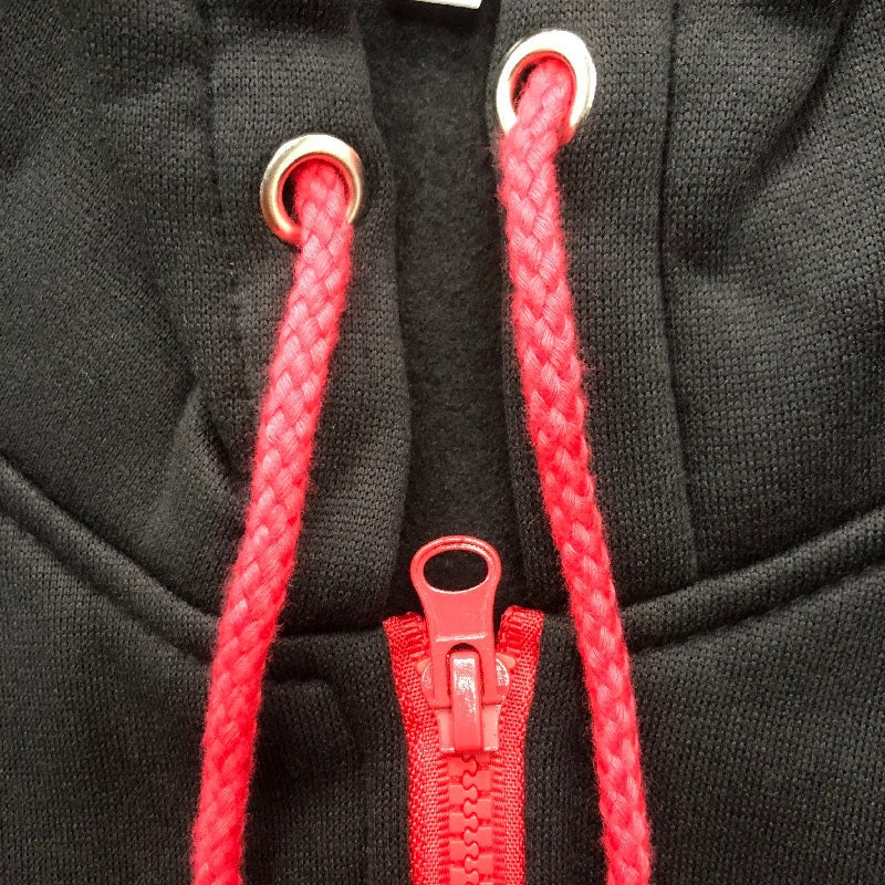 Black hoodie close-up with red drawstrings and red zipper detail | Chaps London