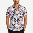 Man wearing white short-sleeve shirt with black skulls and pink floral print | Chaps London