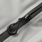 Close-up of gray jacket zipper with black pull cord toggle detail | Chaps London