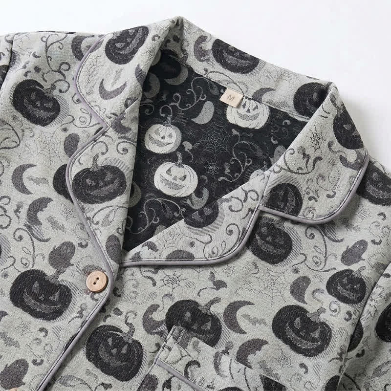 Grey pyjama collar close-up with pumpkin and moon print, lying flat | Chaps London