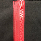 Close-up of black hoodie with red zipper and contrast trim detail | Chaps London