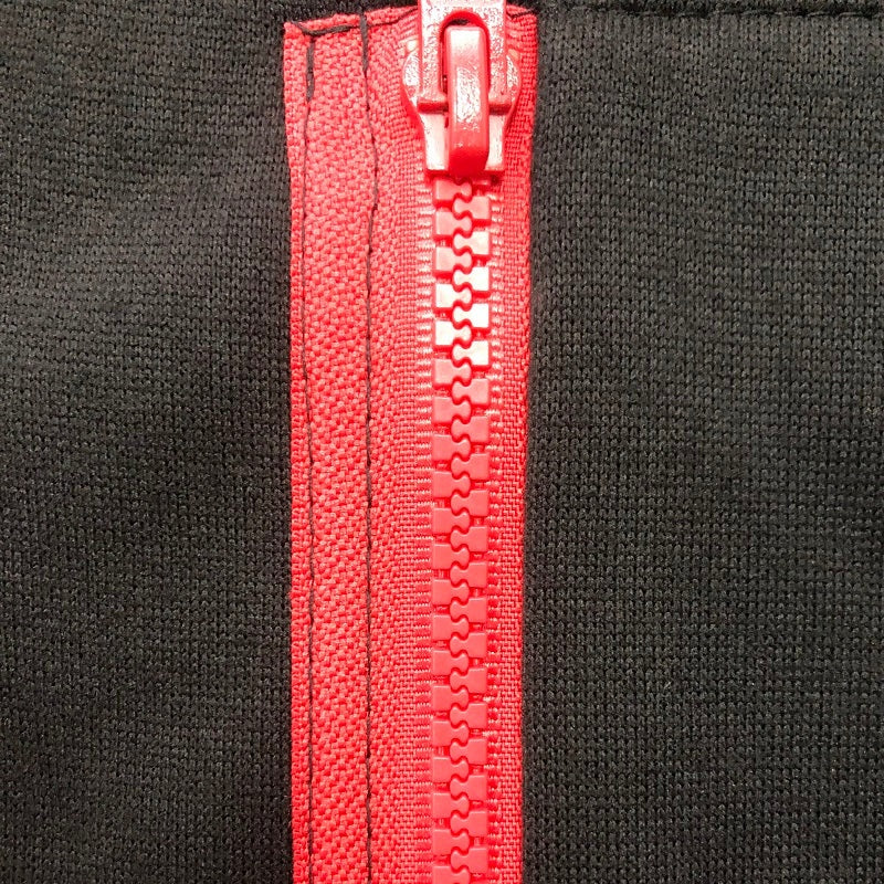 Close-up of black hoodie with red zipper and contrast trim detail | Chaps London