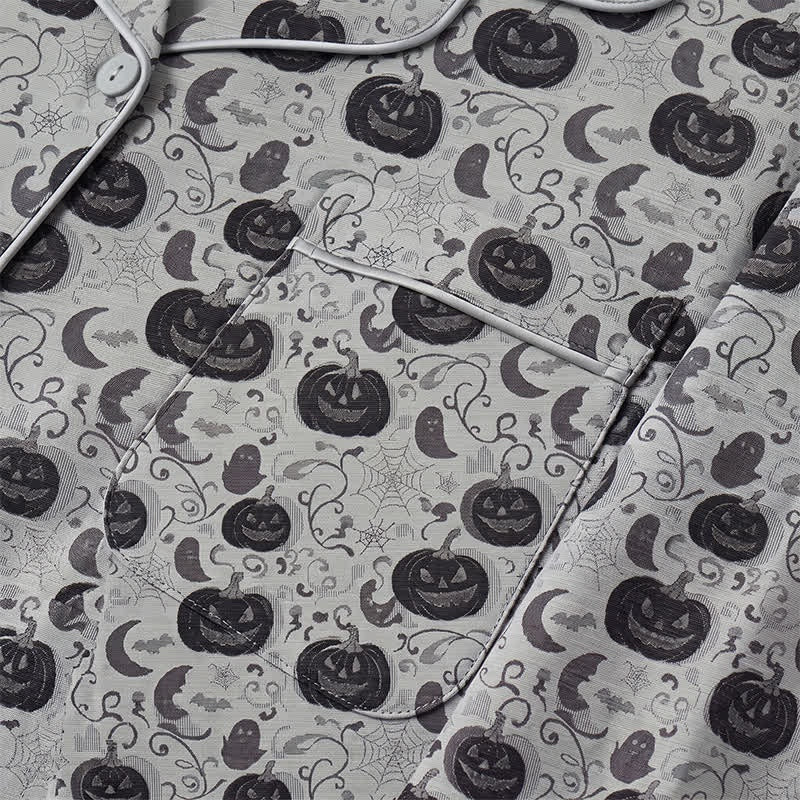 Grey pyjama fabric flat-laid with pumpkin, ghost, bat, and cobweb print | Chaps London