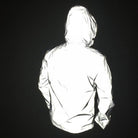 Man wearing reflective silver hooded jacket, back view, highly glossy textured fabric | Chaps London
