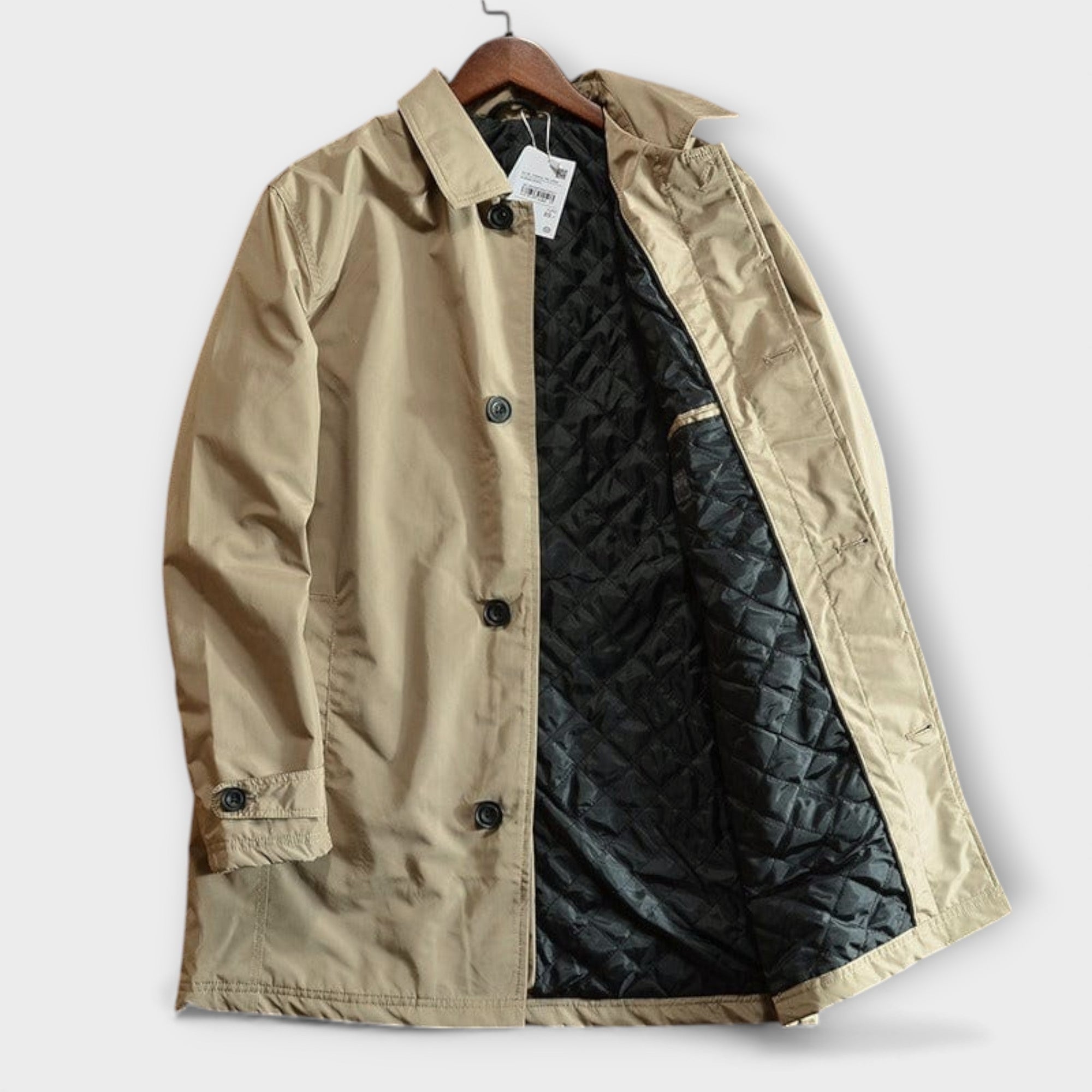Beige cotton rain mac coat on hanger, quilted black lining visible | Chaps London