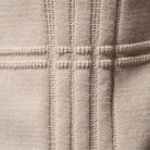 Beige knitted fabric close-up with raised ribbed lines forming grid pattern | Chaps London