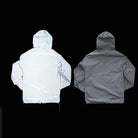 Gray hooded jacket shown flat, reflective fabric glowing white under camera flash | Chaps London