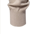 Beige knitted sweater close-up showing ribbed cuff and folded sleeve texture | Chaps London