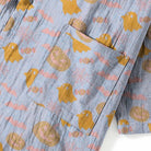Blue fabric with gold ghosts and pumpkins, pocket detail close-up | Chaps London