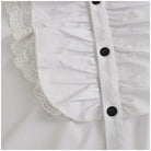 White ruffled shirt placket with black buttons and lace trim detail | Chaps London