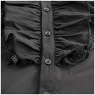 Black ruffled shirt with lace trim, close-up view, worn by person | Chaps London