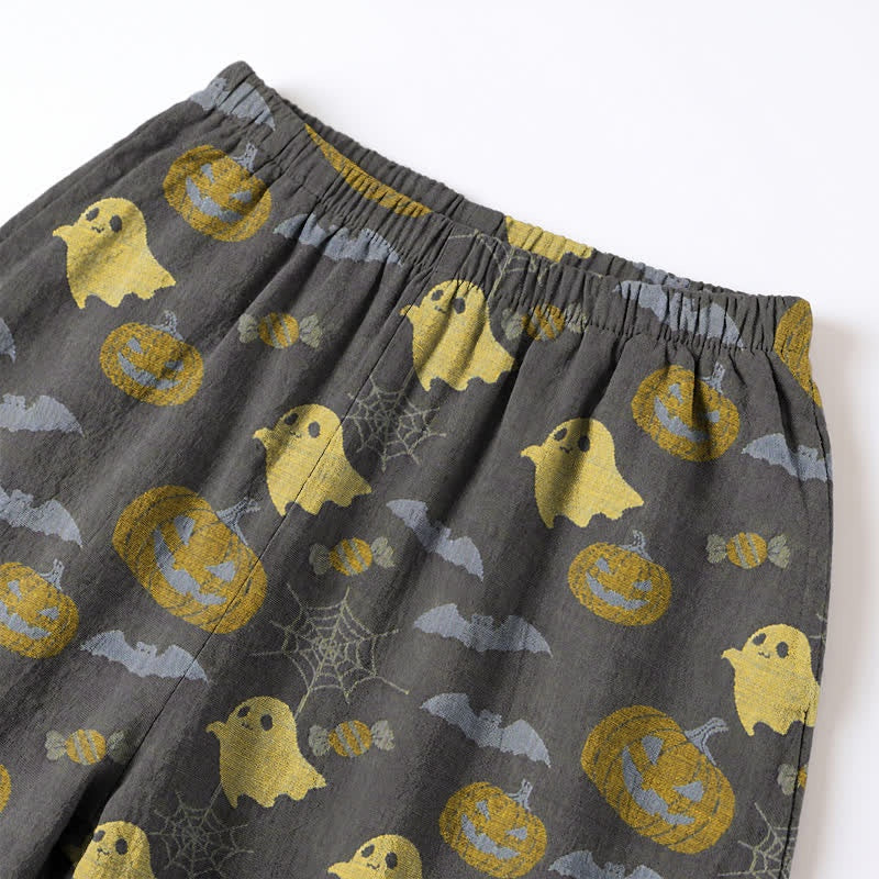 Gray pyjama pants with yellow ghost and pumpkin print, flat lay | Chaps London