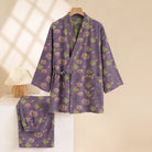 Purple kimono pyjama set with pumpkin and ghost print, hanging on hanger | Chaps London