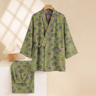 Green kimono pyjama set with pumpkin and ghost print, on hanger | Chaps London