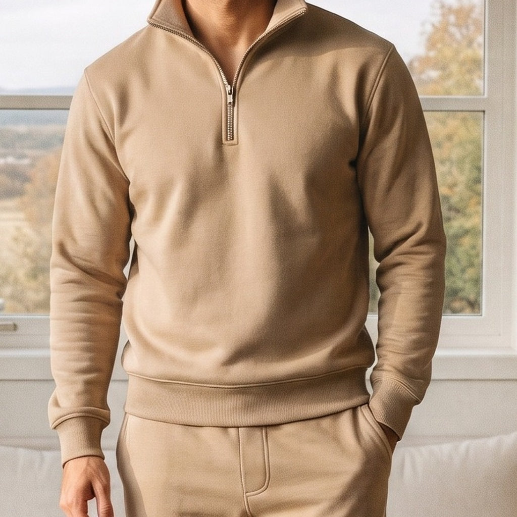 Man wearing beige half zip sweatshirt with matching joggers indoors | Chaps London