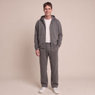 Man wearing dark grey zip hoodie and matching jogger tracksuit | Chaps London