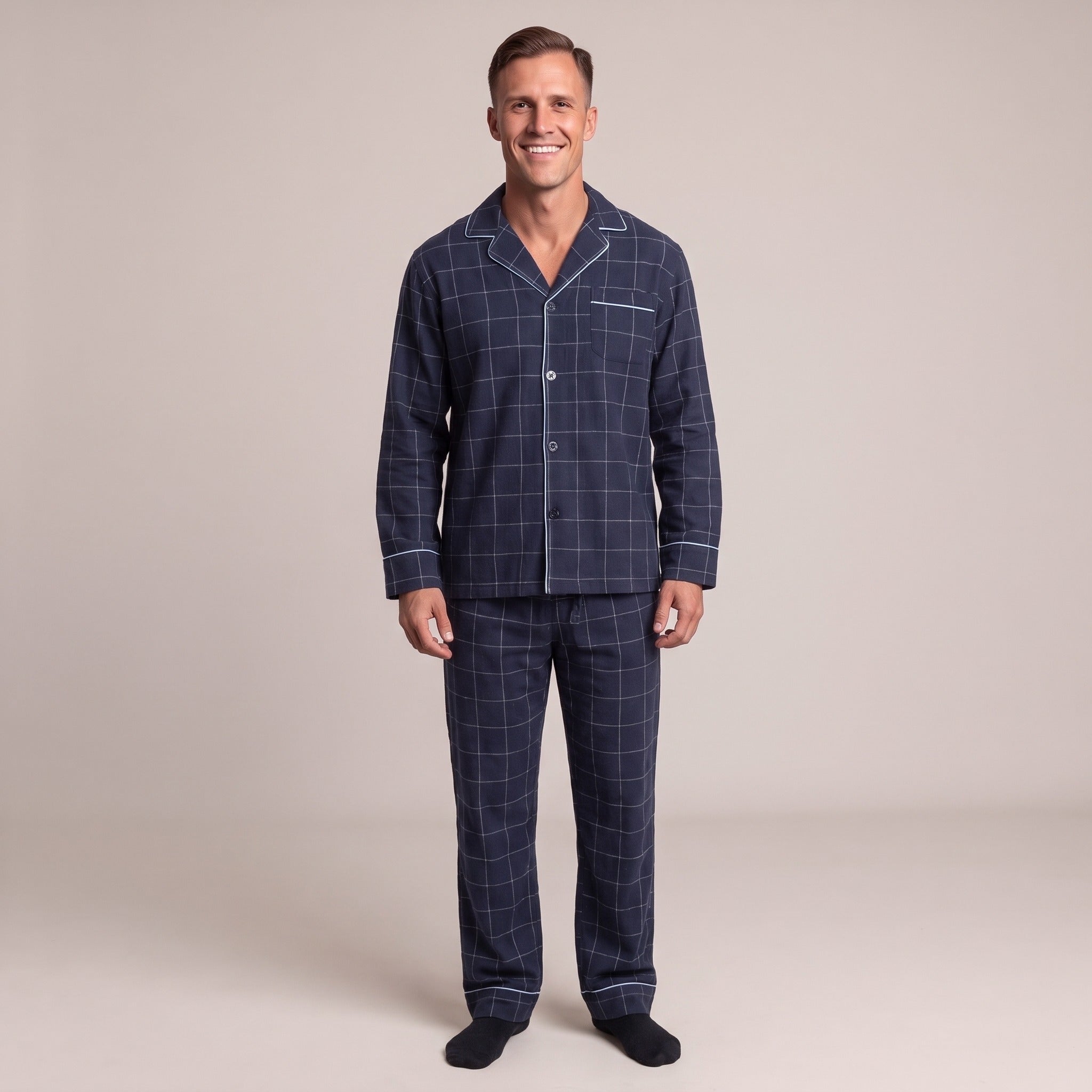 Man wearing navy check flannel pyjama set, smiling, full length worn photo | Chaps London