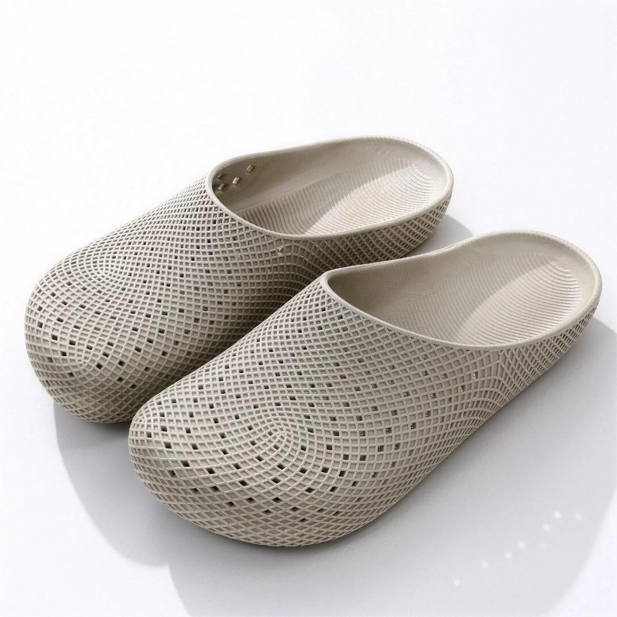 Beige perforated garden clogs with textured woven pattern, shown as a pair | Chaps London
