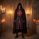 Man wearing black hooded cloak with red cross tunic and belt | Chaps London