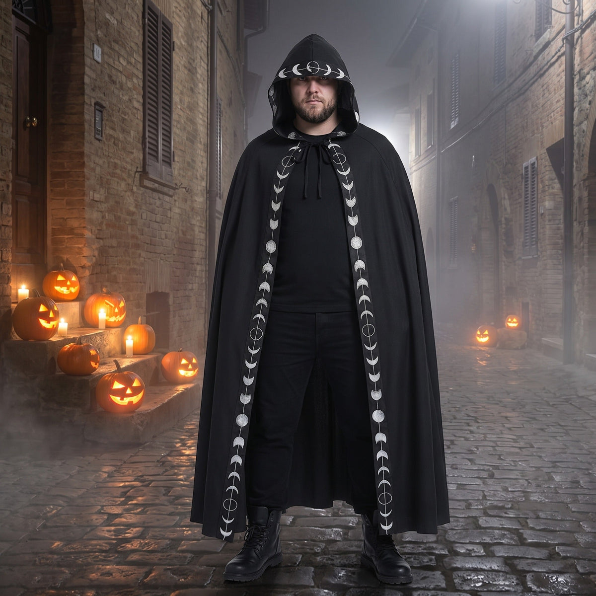 Man wearing black hooded cloak with moon phase trim outdoors | Chaps London
