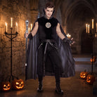 Man wearing black gothic costume with pentagram tunic and gray cape | Chaps London