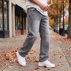 Gray washed wide-leg jeans worn by man on sidewalk | Chaps London