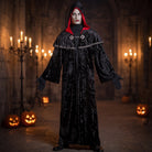 Black hooded robe with red lining worn by person, Halloween setting | Chaps London