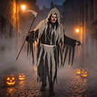 Man wearing black and gray reaper costume with scythe on street | Chaps London