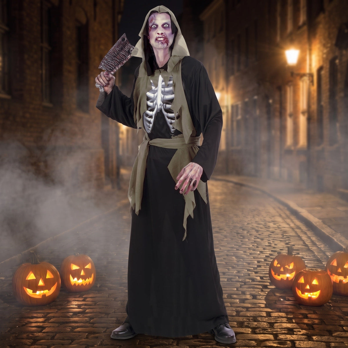 Man wearing black hooded zombie robe with skeleton print, holding prop, outdoor setting | Chaps London