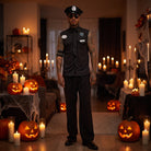 Man wearing black police costume with hat and sunglasses, Halloween pumpkins background | Chaps London