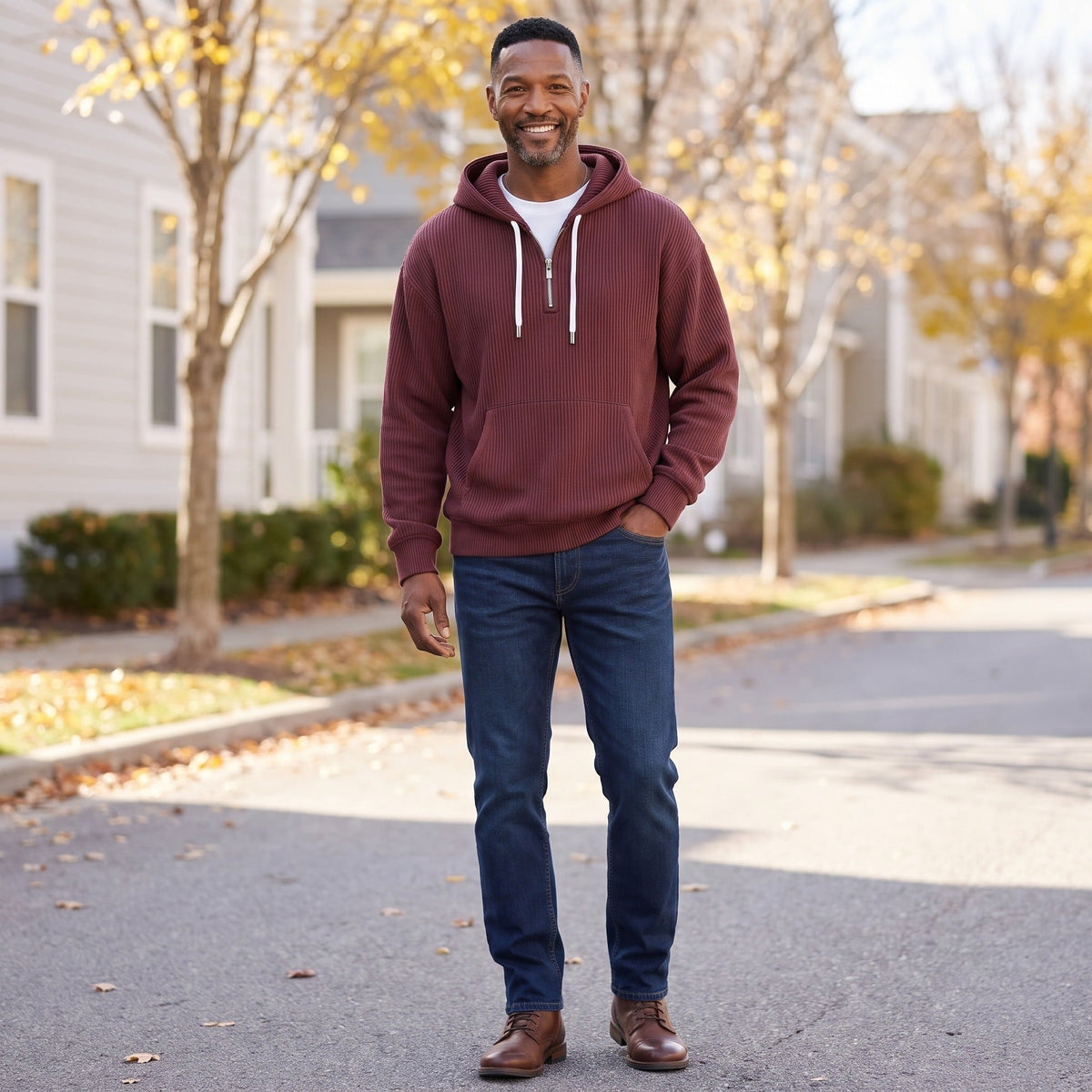 Man wearing maroon half-zip hoodie with white drawcords and jeans outdoors | Chaps London